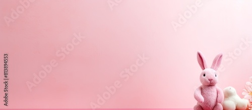 Handmade paper Easter bunny on a pink background with copy space image Perfect for Easter celebrations and messages