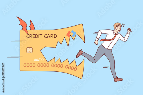 Credit card bites fleeing business man, symbolizing danger of using loan money to cover needs. Credit card chasing guy trying to get rid of debts incurred due to financial illiteracy