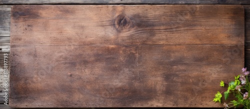 An old wooden wall with a cutting board placed on it providing a rustic and charming scenery for a copy space image