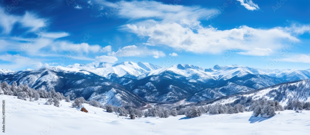 Copy space image Snowy winter landscape of the Rocky Mountains at Pikes Peak under a blue sky with white clouds Copy space image Snowy winter landscape of the Rocky Mountains at Pikes Peak under a blue sky with white clouds