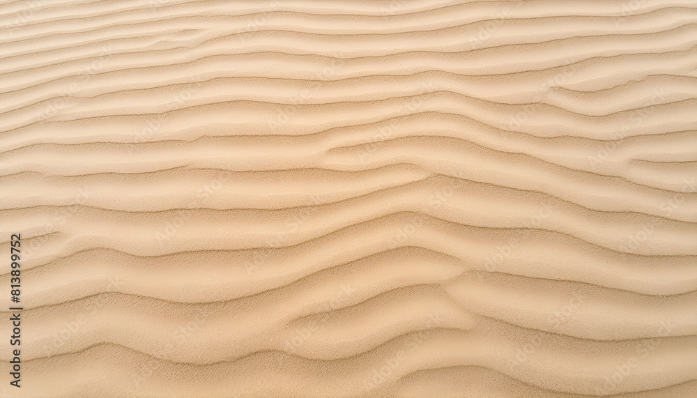 Sand pattern of a beach in the summer with wavy surface and details.