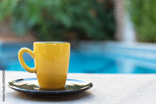 yellow porcelain cup on the breakfast table tea and coffee