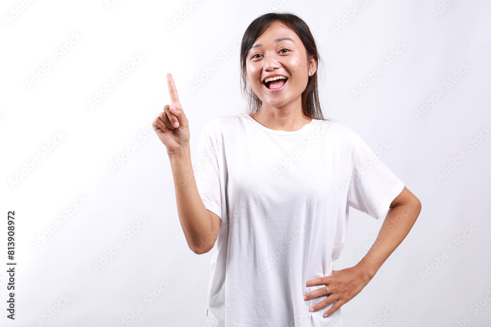 Happy young asian female showing announcement, smiling and pointing finger left at product or project banner, standing white background Happy young asian female showing announcement, smiling and pointing finger left at product or project banner, standing white background