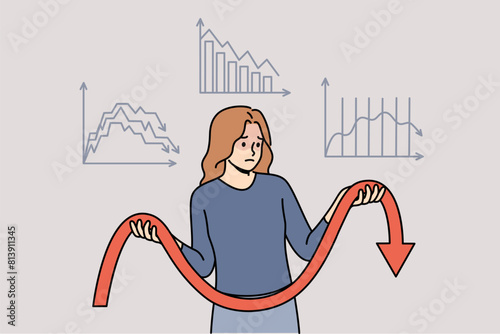 Unsuccessful investments cause negative emotions in woman standing among declining charts. Girl had bad luck and lost income or investments due to crisis and lack of financial analysis