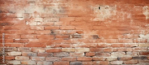 The background of the image depicts a red brick wall with empty space available for copy. Copy space image. Place for adding text and design