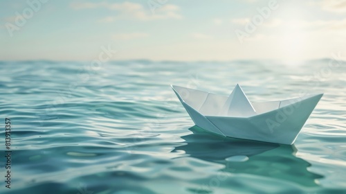 Paper boat floating on clear blue water