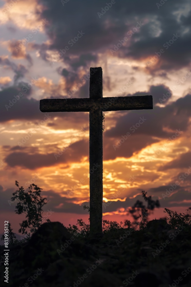 A vibrant sunset provides a dramatic backdrop for the silhouette of a Christian cross, emphasizing the symbol's significance