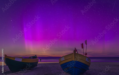 Fototapeta Naklejka Na Ścianę i Meble -  northern lights over fishing boat on the beach