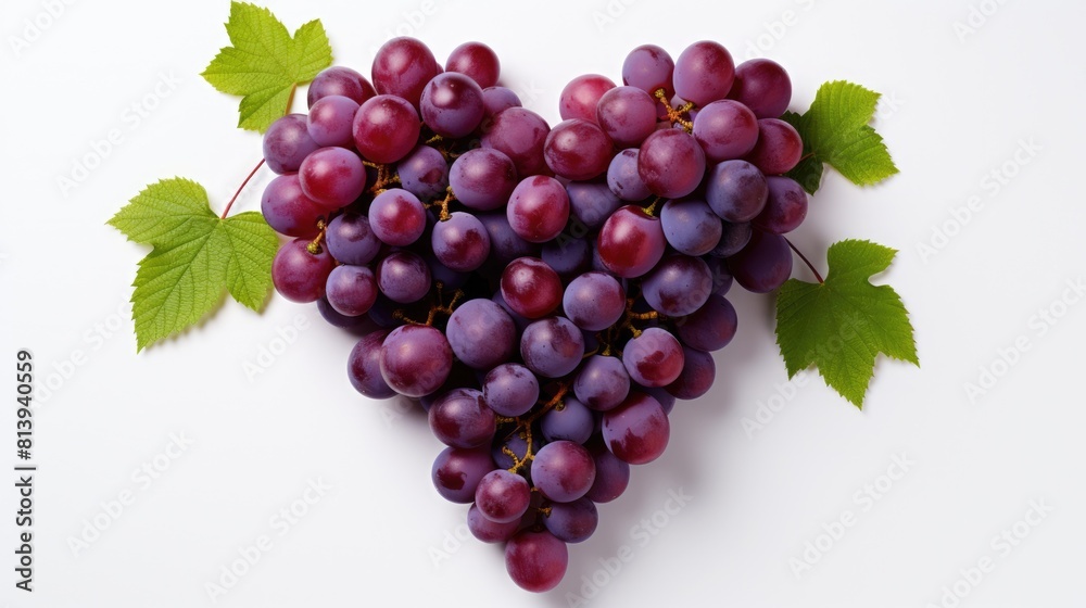 Grapes purple organic in the shape of a heart closeup isolated on a white background with copy space. Love concept