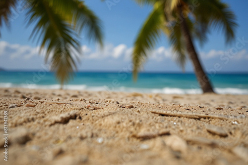 Summer sandy beach with blur ocean in the background