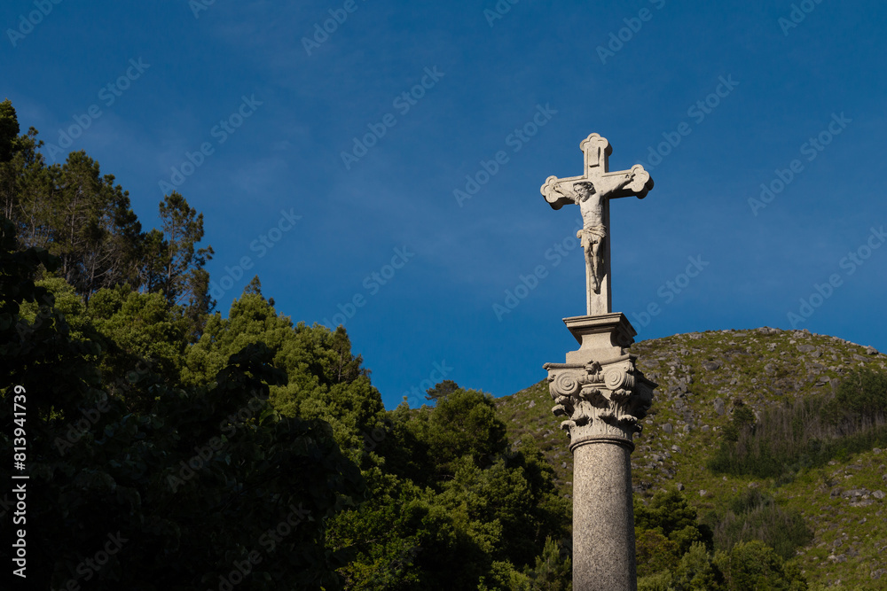 A stone statue Crucifix in the mountain Sanctuary, Terras de Bouro, Braga, Portugal.