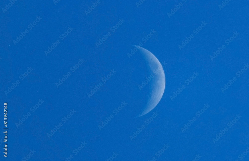 Waxing moon, blue sky, sunny day Waxing moon, blue sky, sunny day