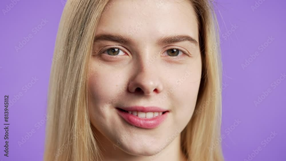 Cute blonde woman,natural beauty.Young girl on violet, charming green eyes,smile Cute blonde woman,natural beauty.Young girl on violet, charming green eyes,smile