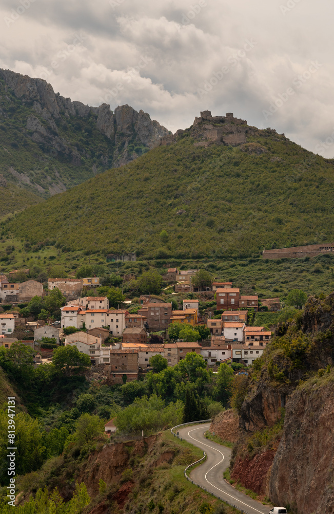 Vertical panorama of village with the castle on top of the hill. Jubera, La Rioja, Spain