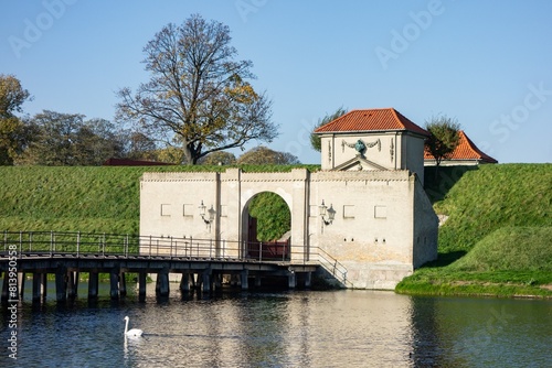 Concrete wall of Kastellet fortress in Copenhagen with Kastelsgraven water canal