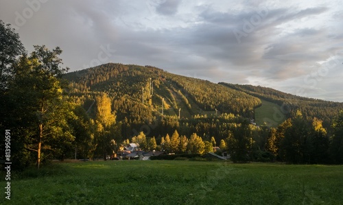 Ski jump slopes in Harrachov Czech Republic covered by grass at sunset