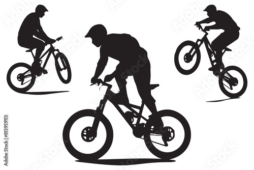 Silhouette of a cyclist jumping on a bicycle