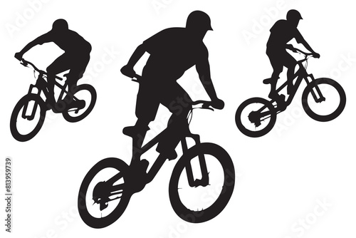 Silhouette of a cyclist jumping on a bicycle