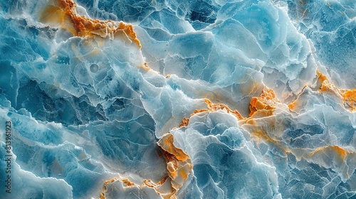  A blue and yellow marble with orange and white swirls on top is seen in this close-up photo