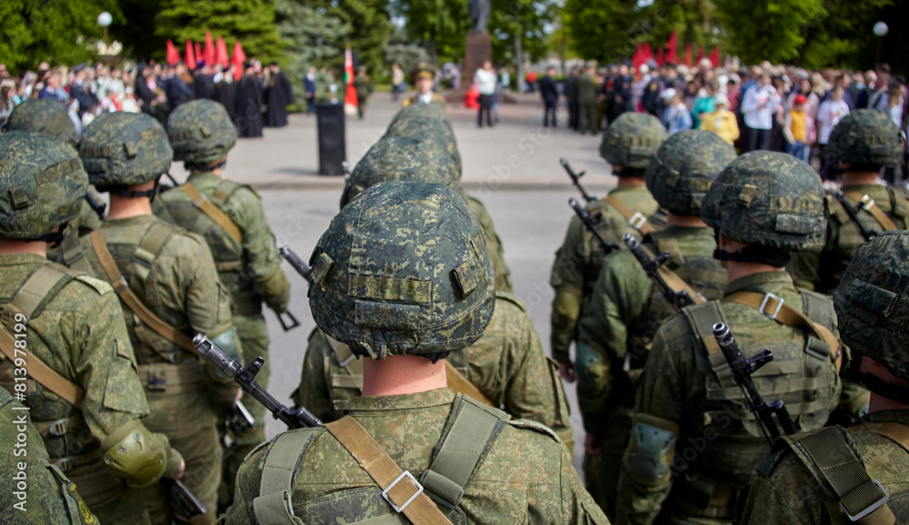 Fototapeta premium Russian soldiers in camouflage uniforms and helmets marching in a military parade