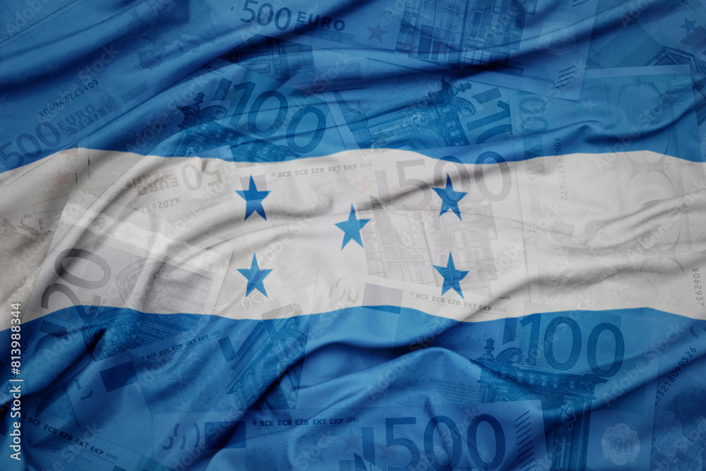 waving colorful national flag of honduras on a euro money banknotes background. finance concept.