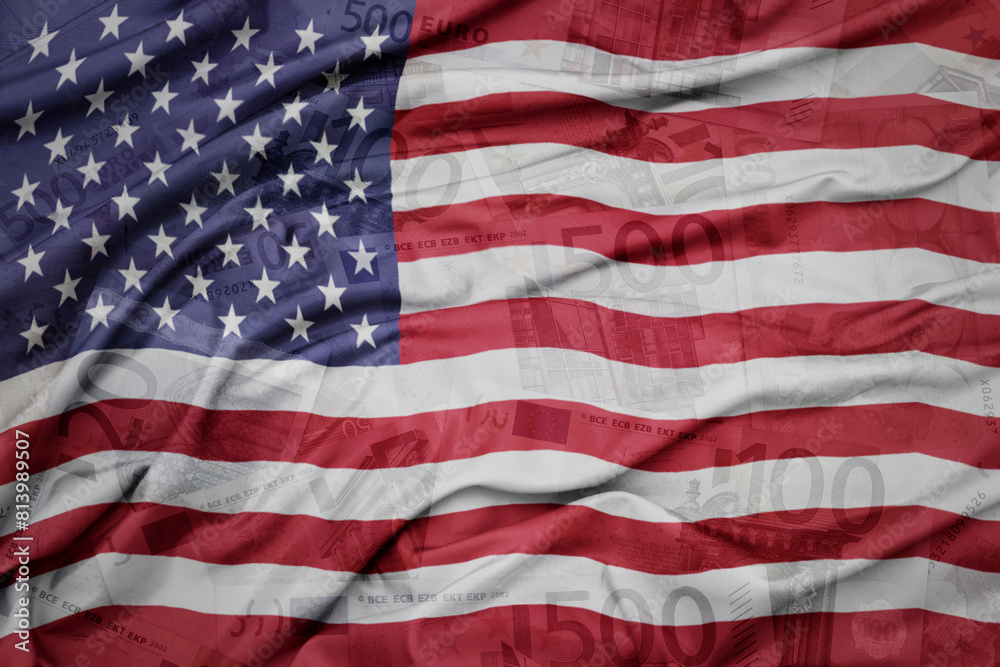 waving colorful national flag of united states of america on a euro money banknotes background. finance concept.