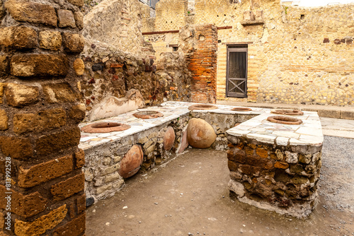 The ancient thermopolium snack bar in the ancient city of Herculaneum, destroyed by Mount Vesuvius photo