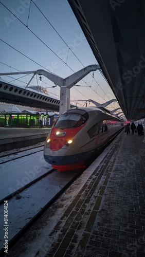 Modern High-Speed Train Ready for Departure at Twilight Railway Station