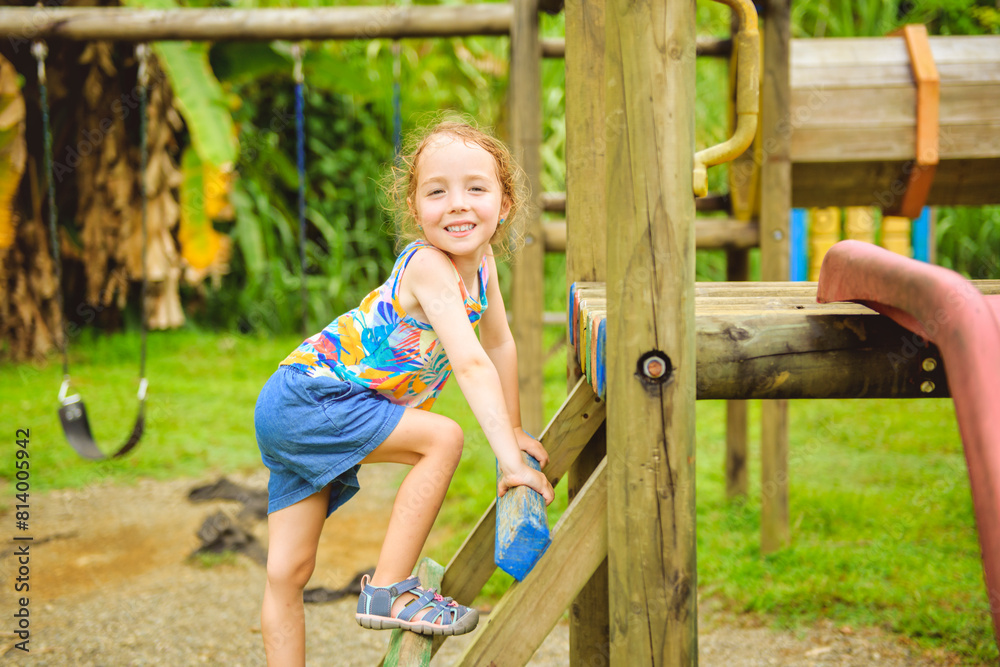 Active little girl having fun on playground Active little girl having fun on playground
