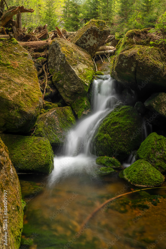 Jeleni waterfall in spring sunny cloudy day in Jizerske mountains Jeleni waterfall in spring sunny cloudy day in Jizerske mountains