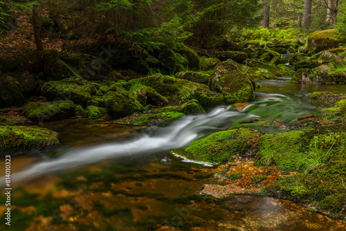 Jeleni waterfall in spring sunny cloudy day in Jizerske mountains photo