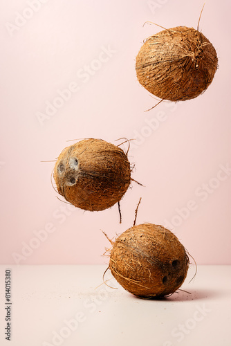 Three whole falling coconuts.
