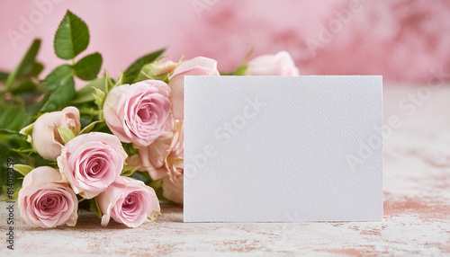 Mock-up of blank white paper card and bouquet of roses. Minimalist style. Floral composition. © hardvicore