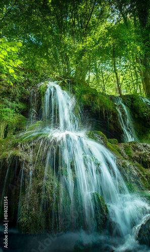 Beautiful spring waterfall Dokuzak in Strandzha Mountain, Bulgaria . Strandja mountain, waterfall in the forest. Magnificent landscape near Burgas