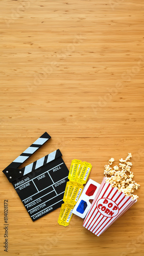 Cinema clapperboard, popcorn, tickets and 3d glasses