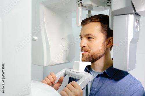 Panoramic image of teeth. A patient in a modern dental clinic takes a panoramic picture of the teeth. Prevention of dental diseases. Accurate diagnosis.