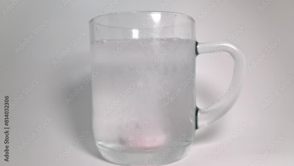 Diluting an aspirin tablet in a glass of water Diluting an aspirin tablet in a glass of water