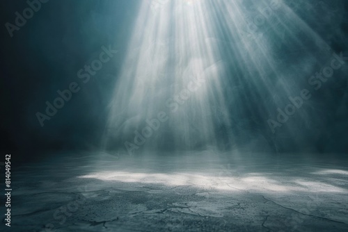 A dark room with a beam of light shining from the ceiling. Suitable for concepts of hope, enlightenment, or mystery