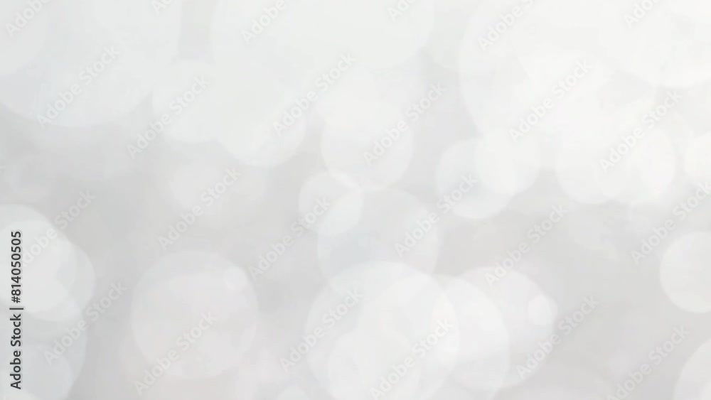 White abstract video background with slowly rotating particles with shimmering round bokeh light flashes. Abstract background with white bokeh. White abstract video background with slowly rotating particles with shimmering round bokeh light flashes. Abstract background with white bokeh.