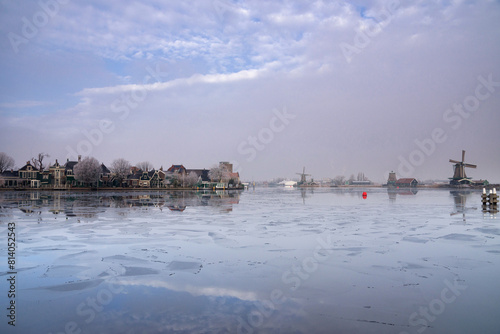 View over a frozen river Zaan to Zaandijk photo