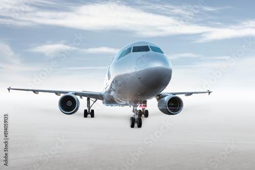 Passenger aircraft isolated on bright background with sky