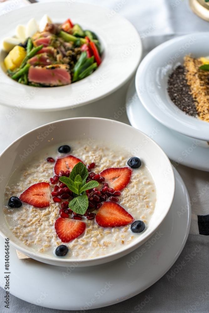 Healthy Breakfast, Oatmeal Porridge With Summer Berries on a Table Healthy Breakfast, Oatmeal Porridge With Summer Berries on a Table