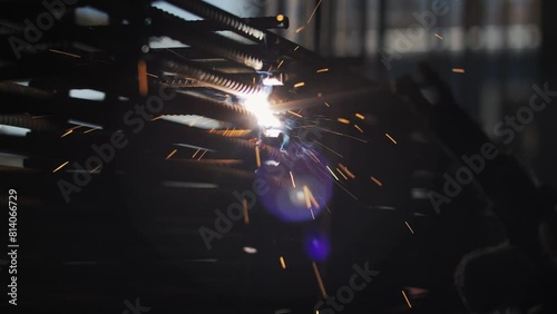 Welding of metal reinforcement on the construction site photo