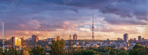 The sunset light illuminated the city skyline with picturesque clouds in the sky. Kyiv, Ukraine.