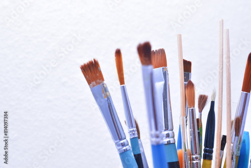 a set of dirty brushes and paintbrushes from having painted too much