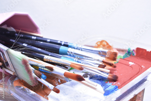 a set of dirty brushes and paintbrushes from having painted too much