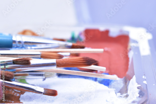 a set of dirty brushes and paintbrushes from having painted too much