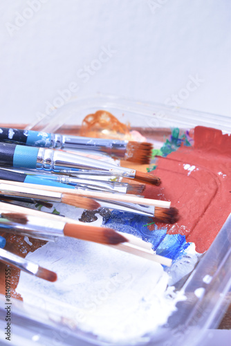 a set of dirty brushes and paintbrushes from having painted too much
