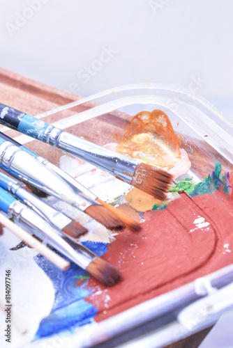 a set of dirty brushes and paintbrushes from having painted too much