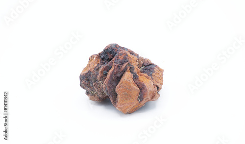 red and black porous volcanic rock called scoria, an igneous formation from volcanic gasses mixing with magma before spewing from a volcano. isolated on white background. used in grills and landscapes